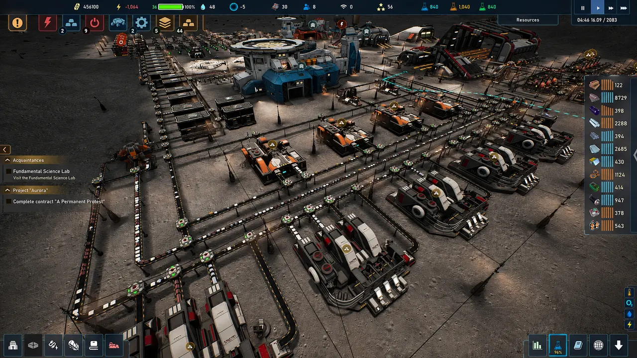 A colony overview seen from above, with conveyor lines threading between storage modules and orange production units