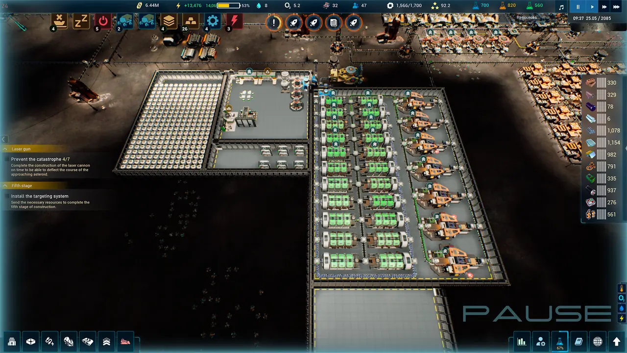 A top-down view of a lunar colony at night with rows of green battery racks and orange machinery, and a paused mission-log panel down the left side showing the laser cannon quest objectives